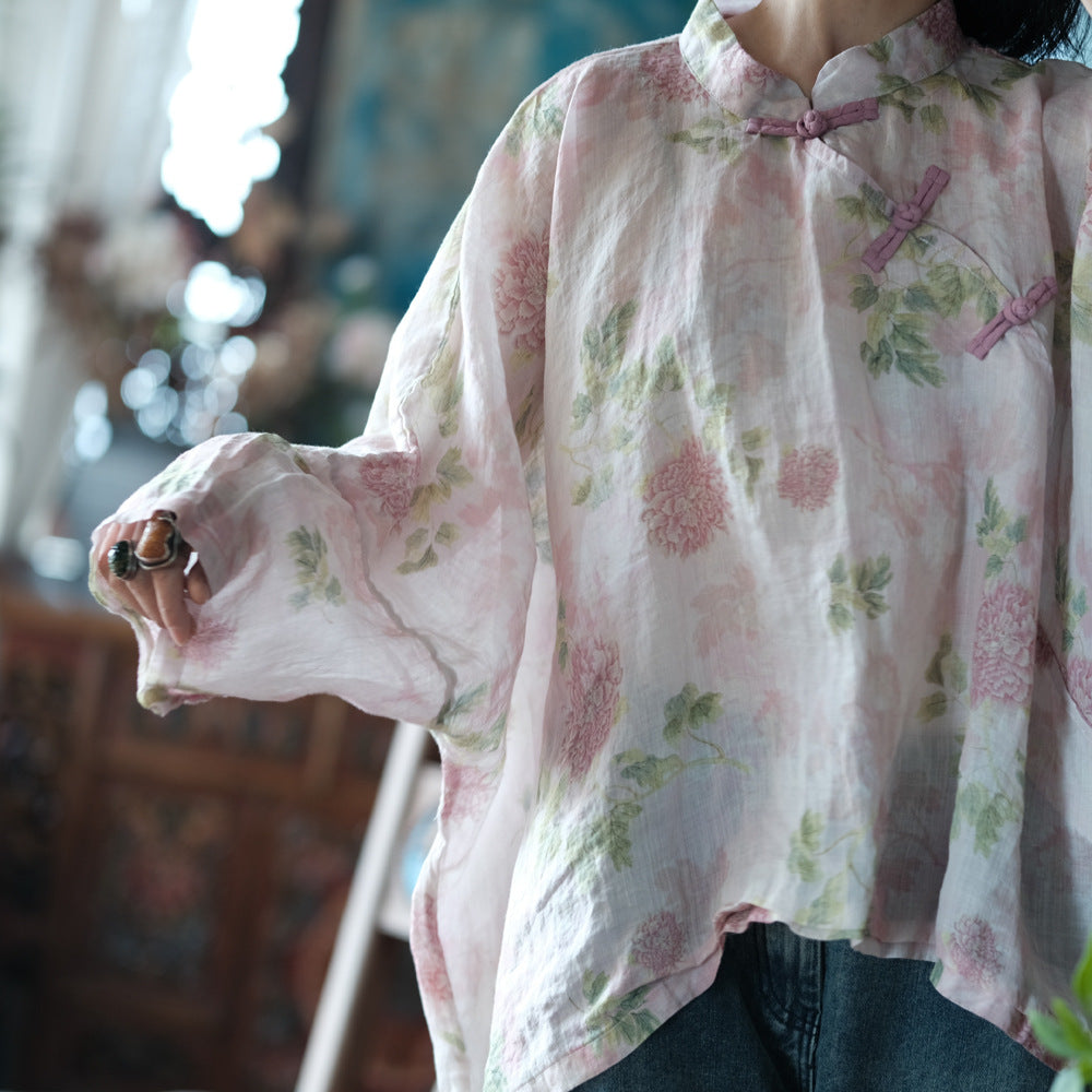 Blusa vintage floral con estampado de viento y cruz