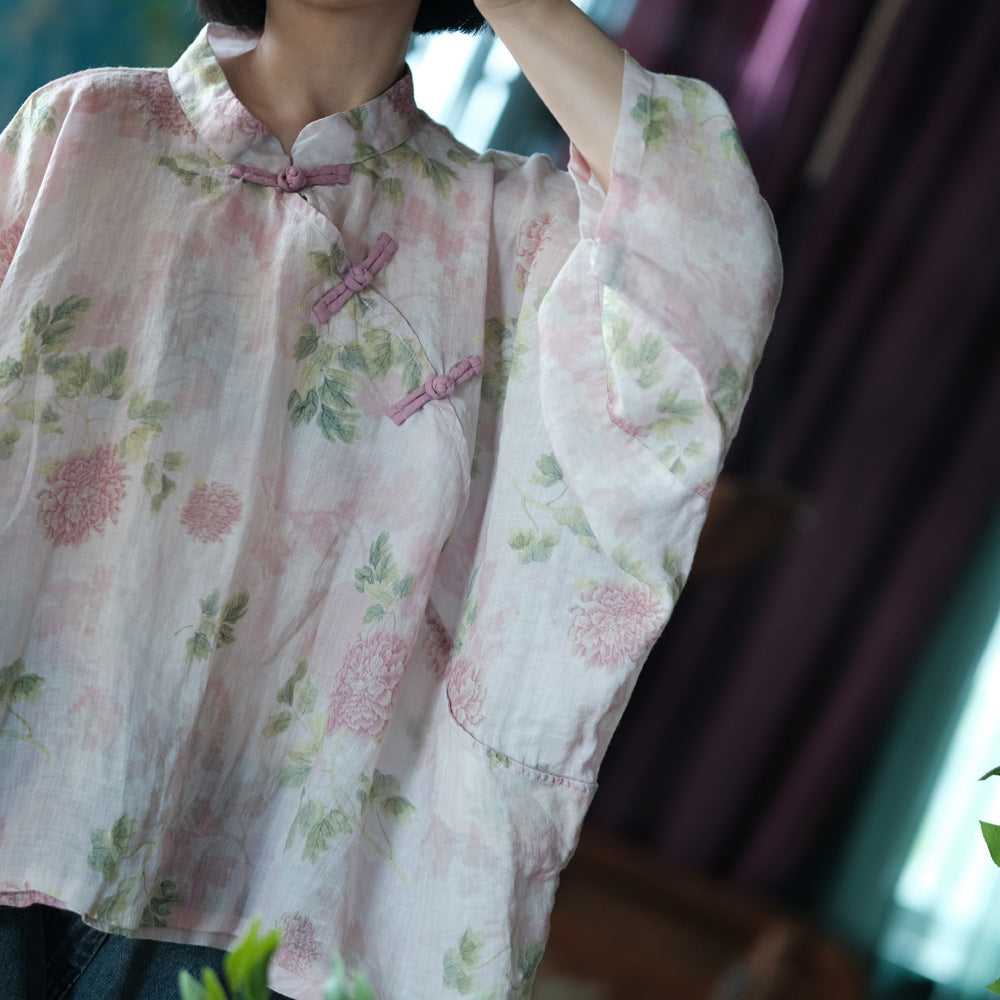 Blusa vintage floral con estampado de viento y cruz