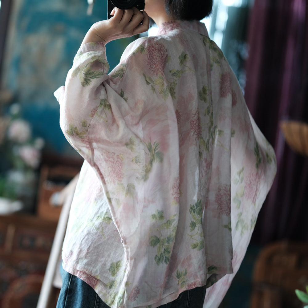 Blusa vintage floral con estampado de viento y cruz