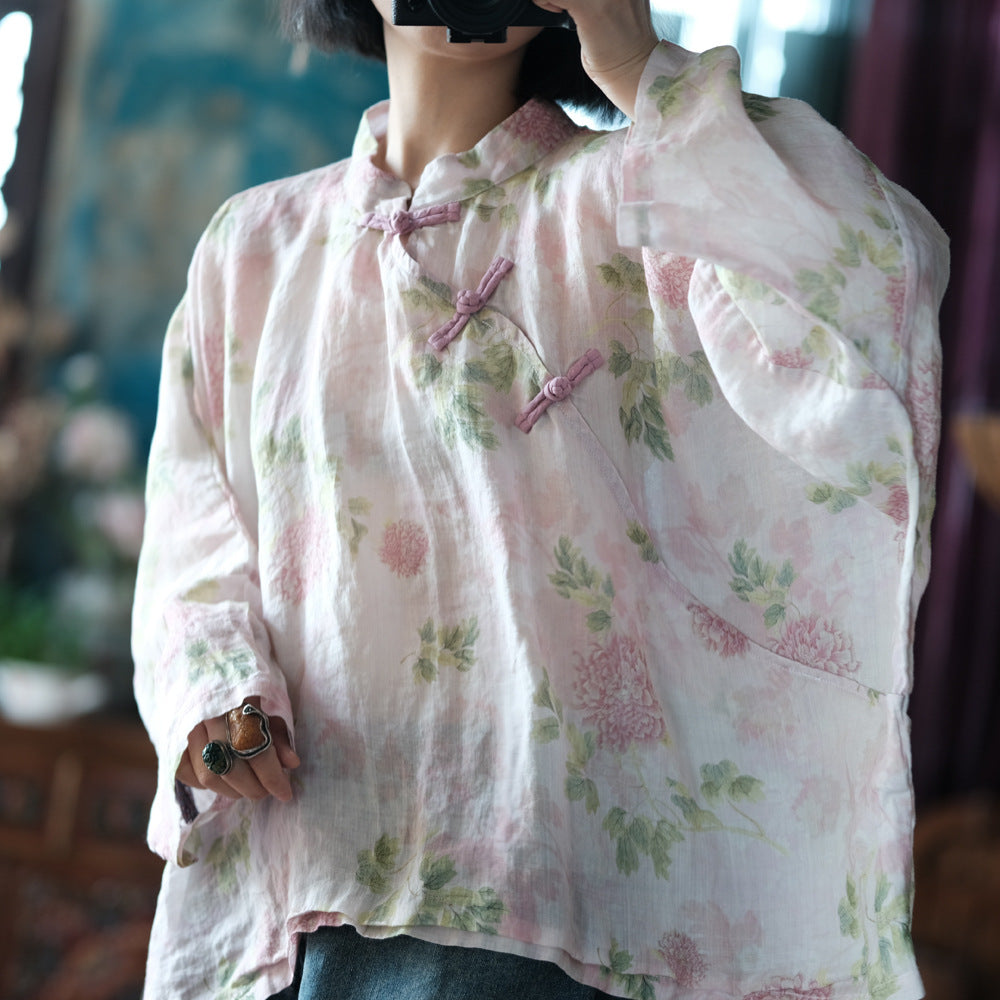Blusa vintage floral con estampado de viento y cruz