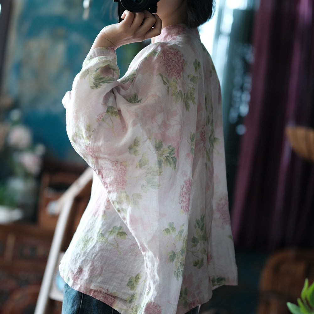 Blusa vintage floral con estampado de viento y cruz