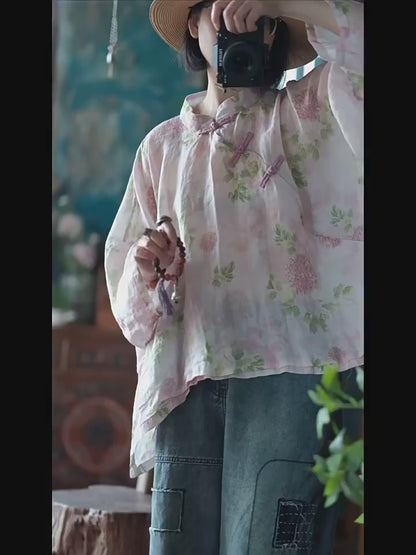 Blusa vintage floral con estampado de viento y cruz